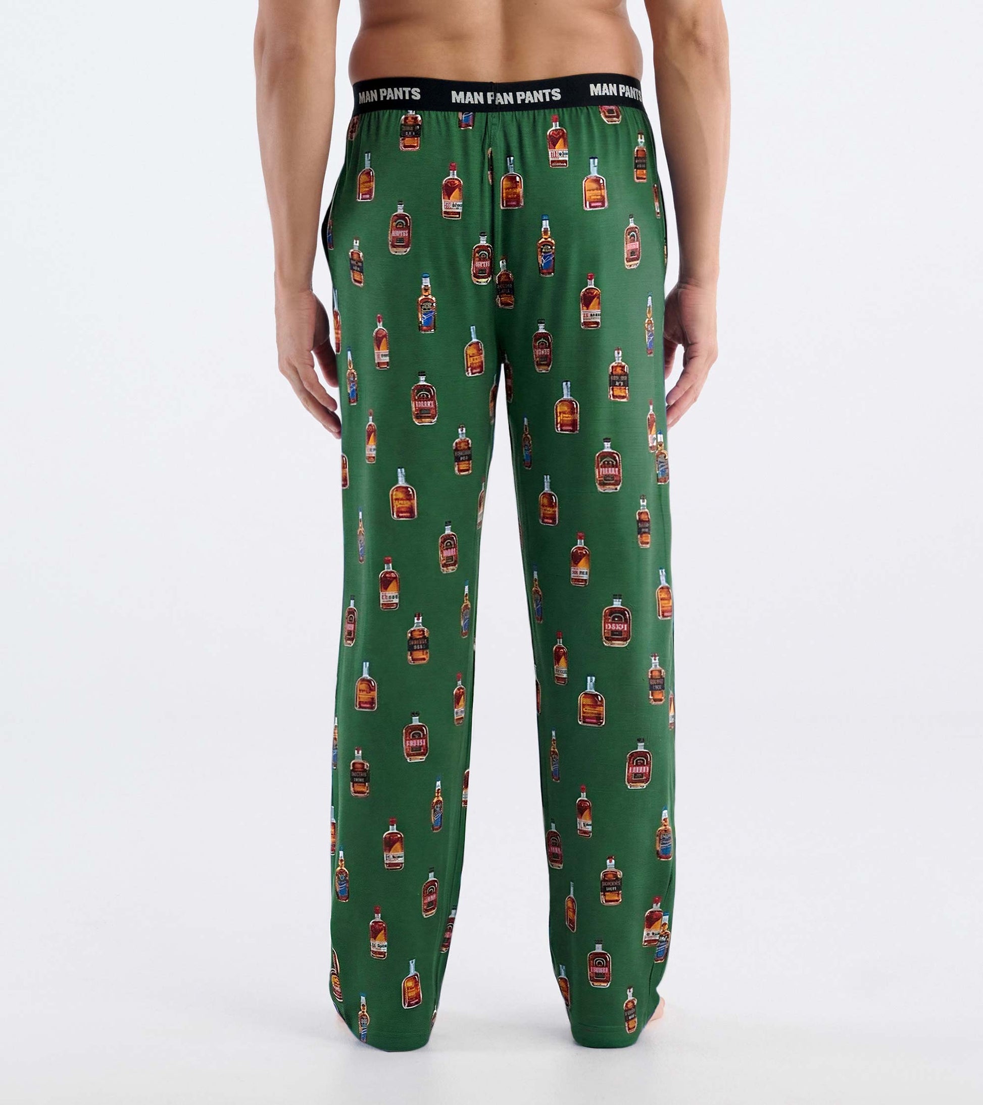 Green pajama pants with allover bourbon bottle print and black elastic waistband, back view