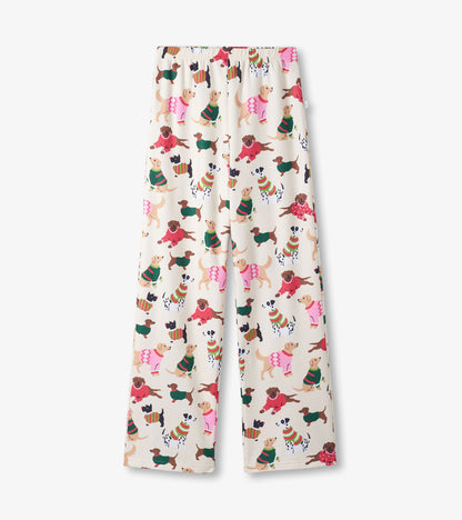 Cream-colored pants featuring a playful pattern of dogs in sweaters, designed for girls.