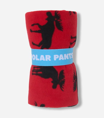 Red polar pants featuring a black moose pattern, rolled and secured with a blue band.