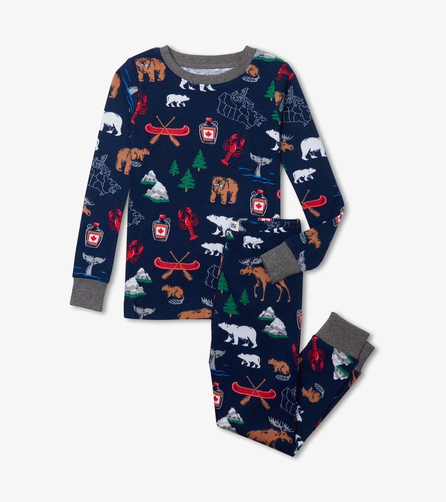 Kids pajama set with navy top and pants, gray trim, and Canada-themed print with bears, moose, canoes and trees