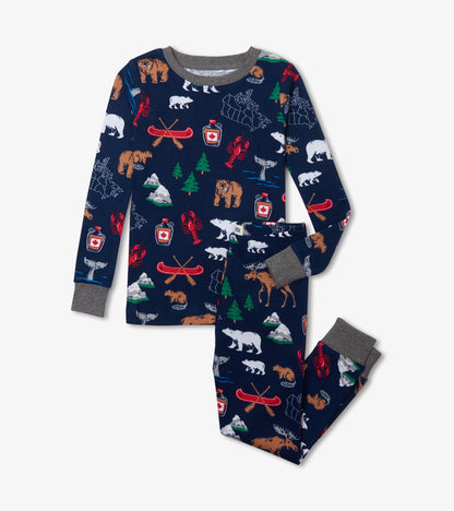 Kids pajama set with navy top and pants, gray trim, and Canada-themed print with bears, moose, canoes and trees