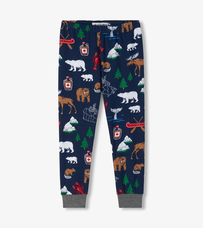 Kids pajama pants in navy with gray ankle cuffs and Canada-themed print with bears, moose, trees and canoes
