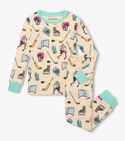 Kids pajama set with cream top and pants, aqua trim, and hockey print with players, sticks, helmets, skates, and nets