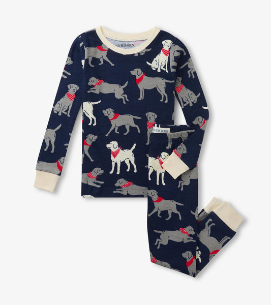 Kids pajama set with navy long-sleeve top and pants, gray and white labs print, and cream cuffs
