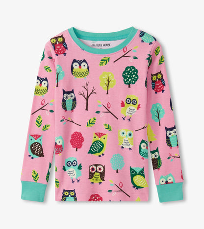 Pink long-sleeve pajama top featuring colorful owl and tree patterns, with turquoise cuffs and neckline.