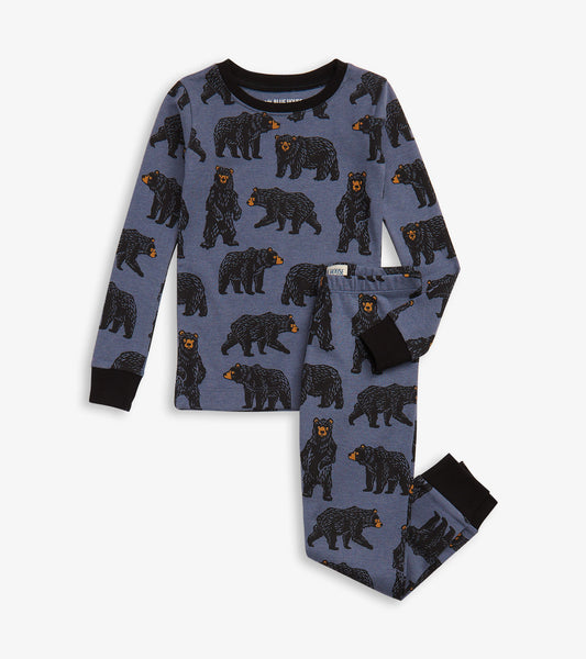 Blue pajama set featuring a bear pattern, with long sleeves and pants, accented with black cuffs.