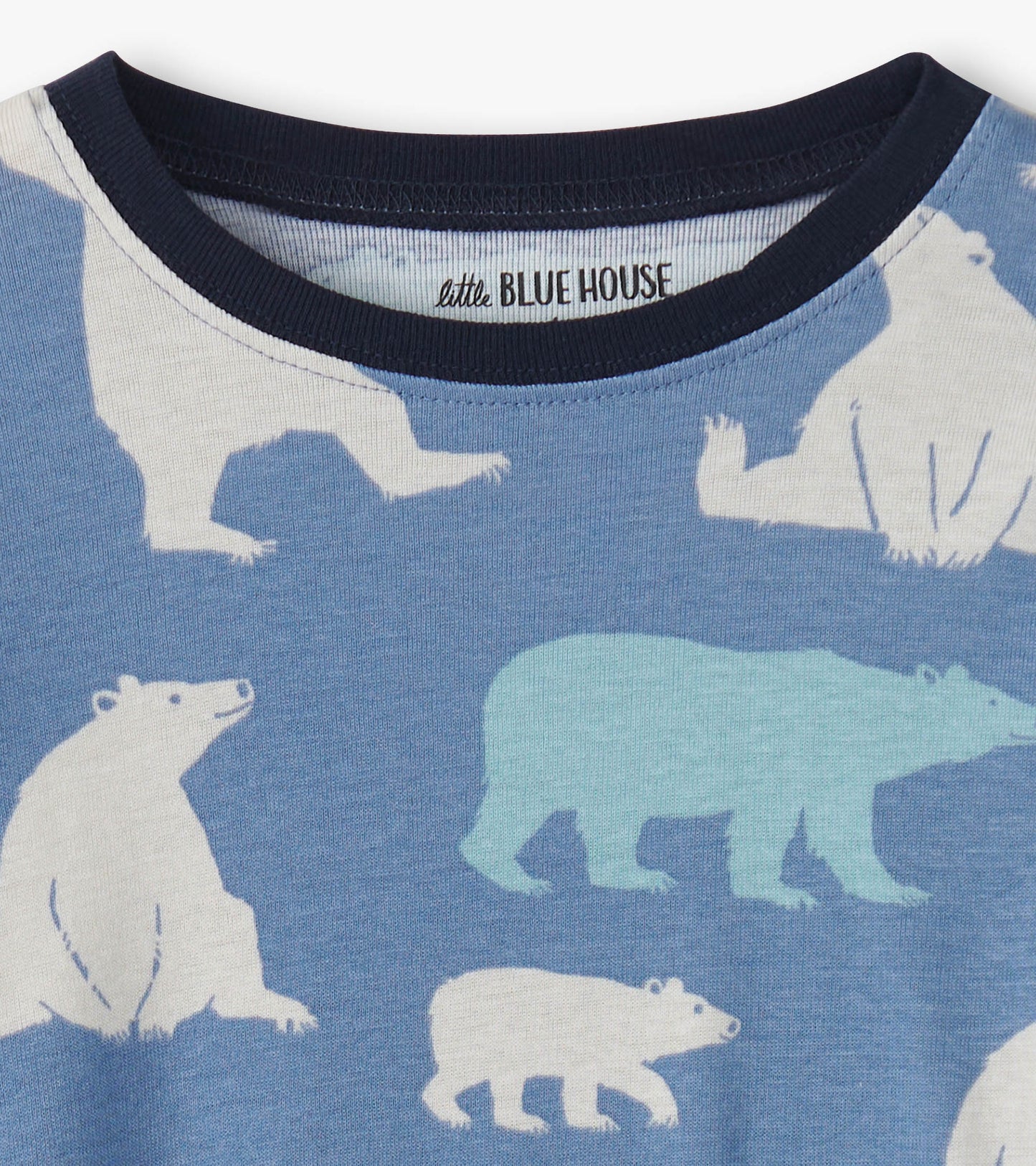 Blue pajama set featuring polar bear patterns, with a soft fabric and a navy crew neckline.