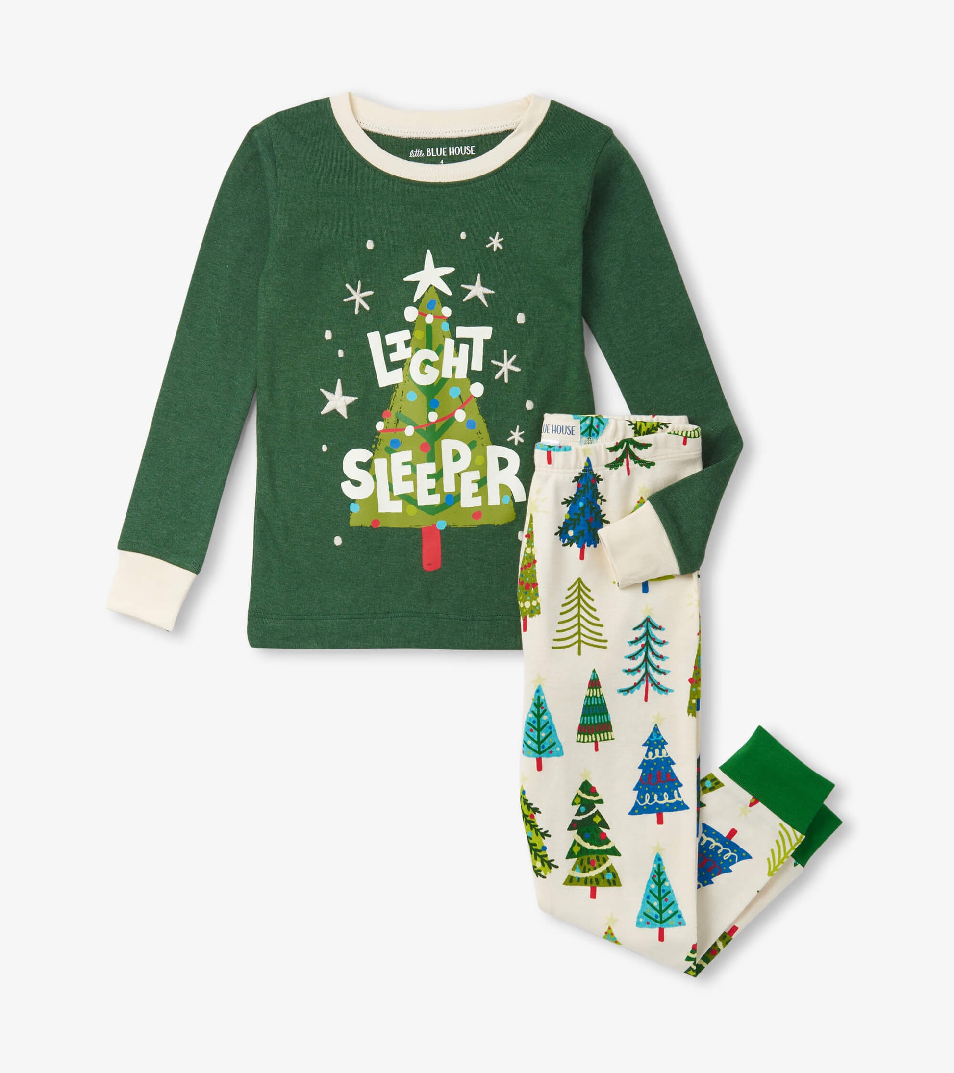 Green long-sleeve top with "Light Sleeper" text and white pants featuring colorful Christmas tree patterns.