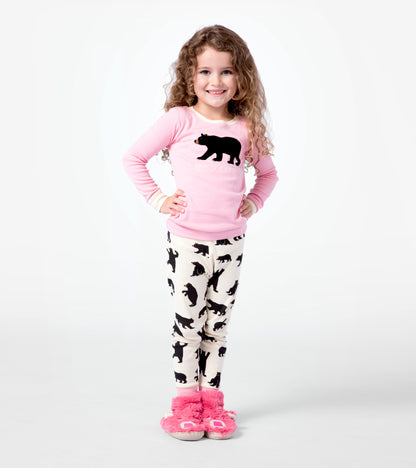 Pink long-sleeve pajama top with black bear graphic paired with cream pants featuring black bear silhouettes.