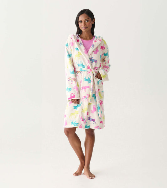 Women's white fleece robe with colorful moose print, hood, tie waist, and front pockets, worn on model