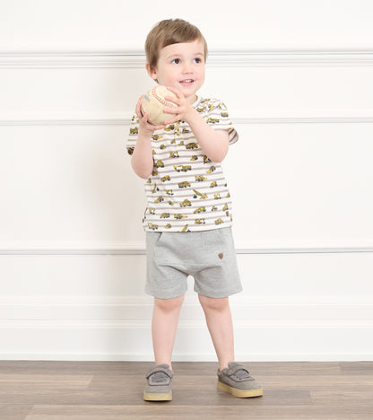 Grey toddler athletic shorts on a child, front view, with a kangaroo pocket and small logo patch.