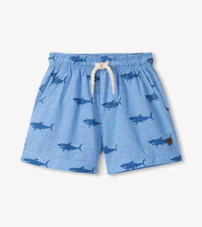 Light blue pull-on shorts with shark print, elastic waistband, and white drawstring, front view