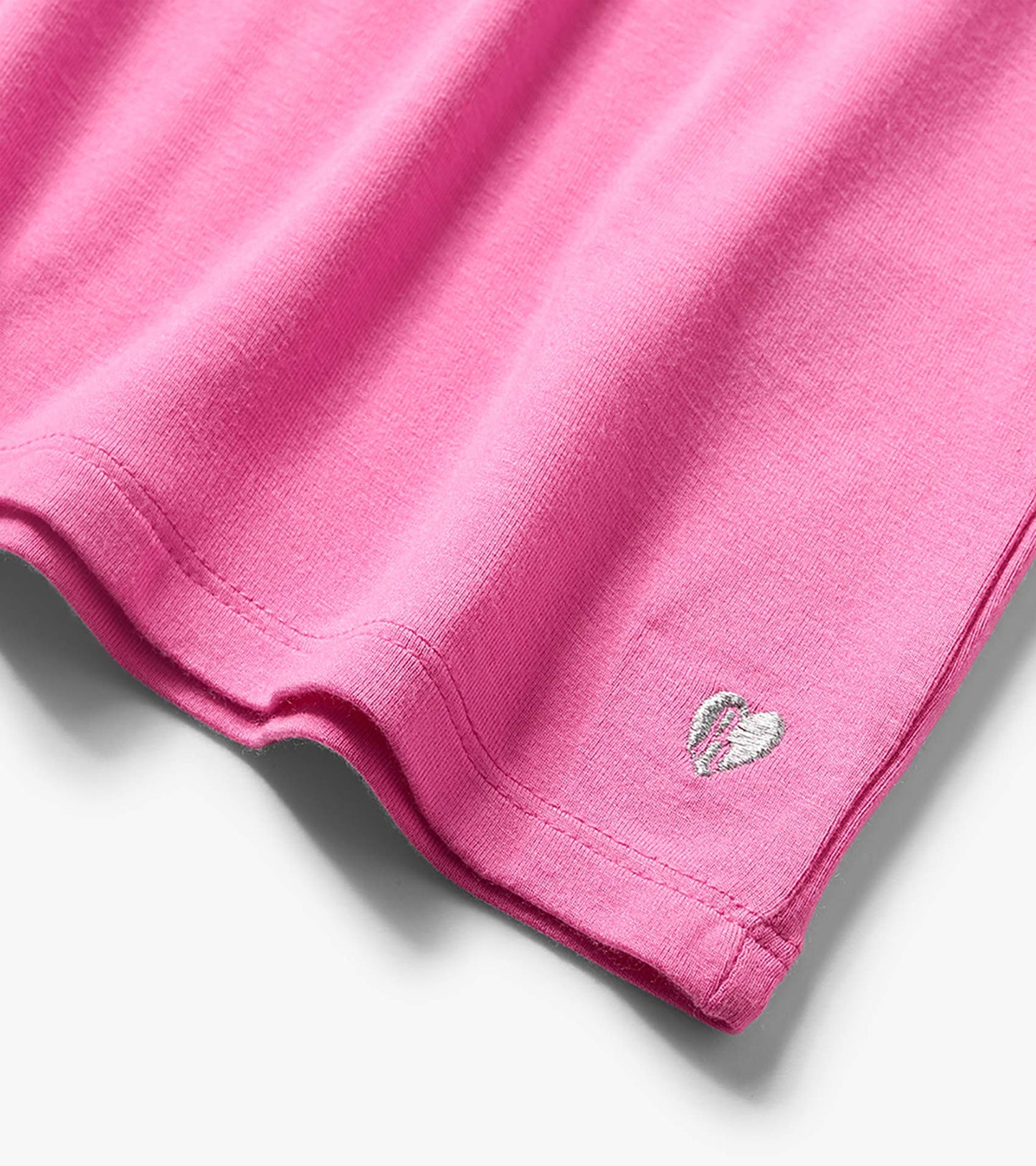 Pink girls' T-shirt hem with small embroidered heart detail