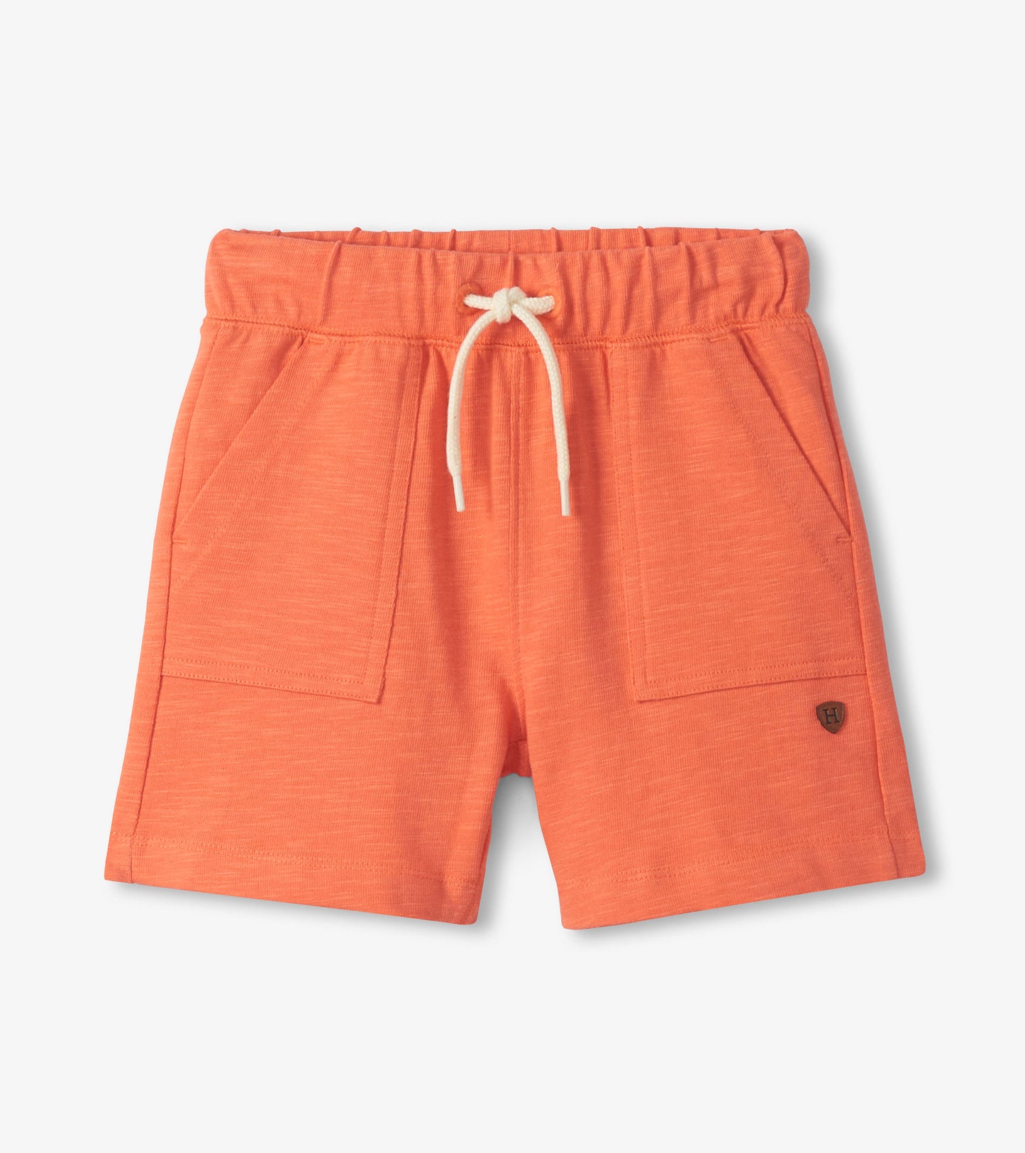 Coral boys shorts with elastic waistband, white drawstring, front pockets, and small logo patch
