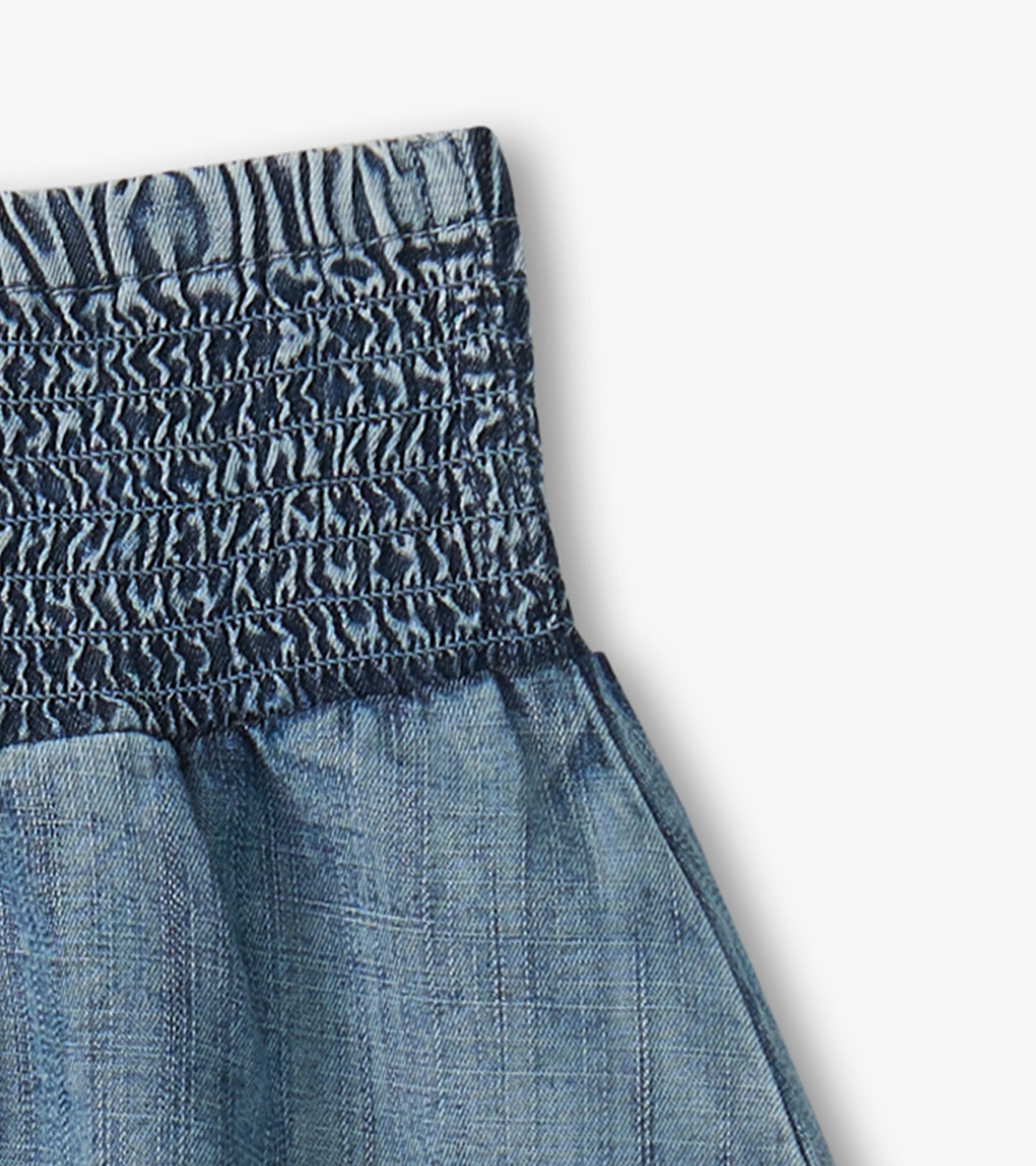 Light blue Tencel smocked skirt with a gathered waistband, suitable for casual wear.