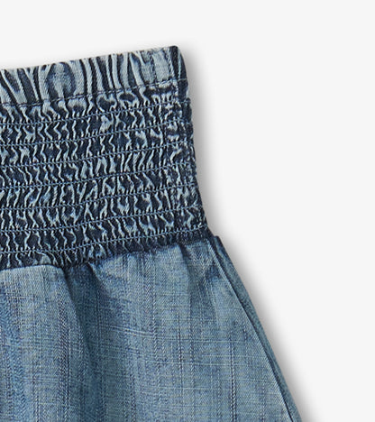 Light blue Tencel smocked skirt with a gathered waistband, suitable for casual wear.