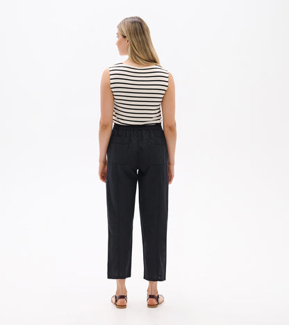 Back view of black straight-leg linen pants with an elastic waistband and cropped hem