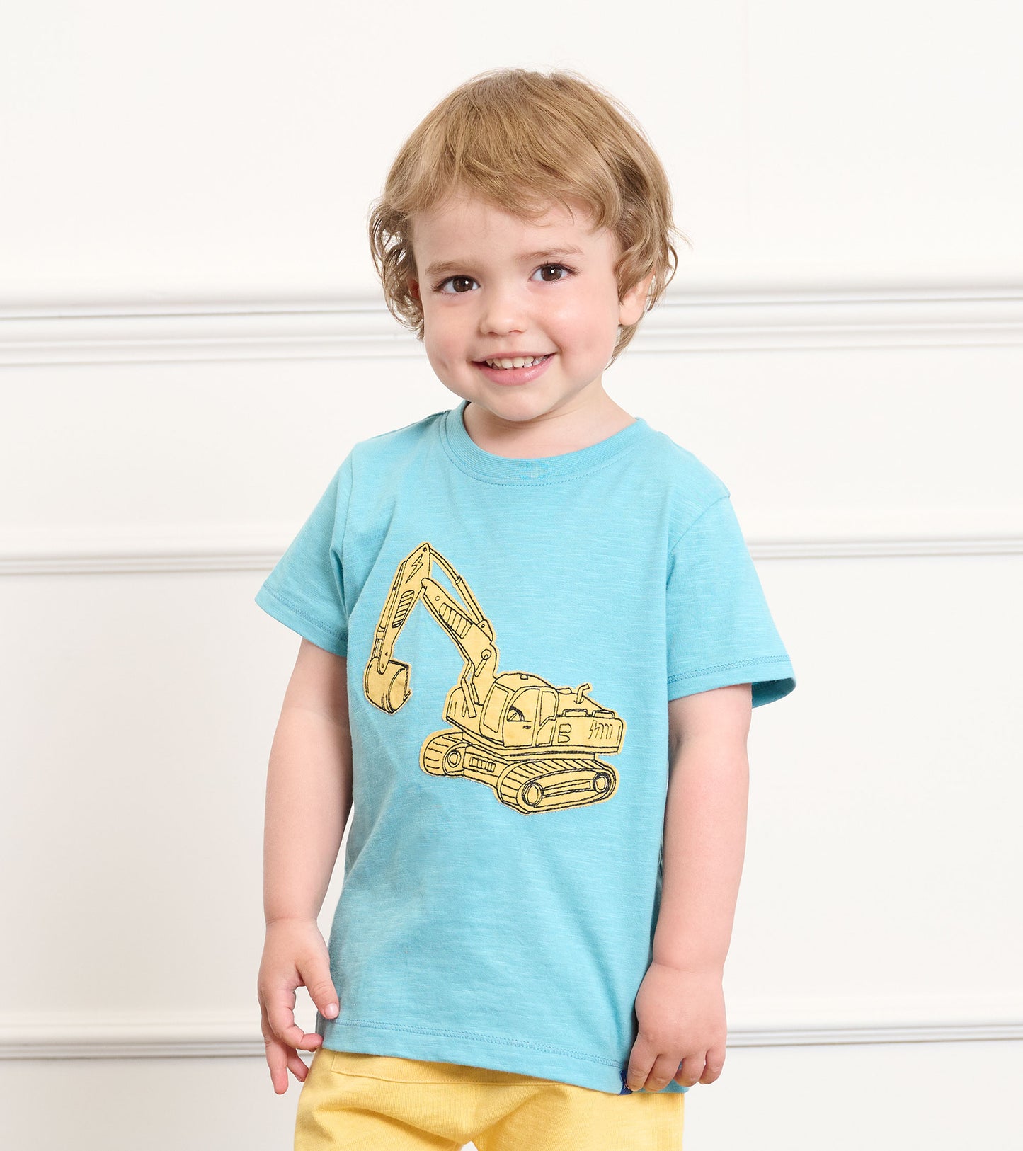 Light blue toddler T-shirt with yellow excavator graphic, short sleeves, front view