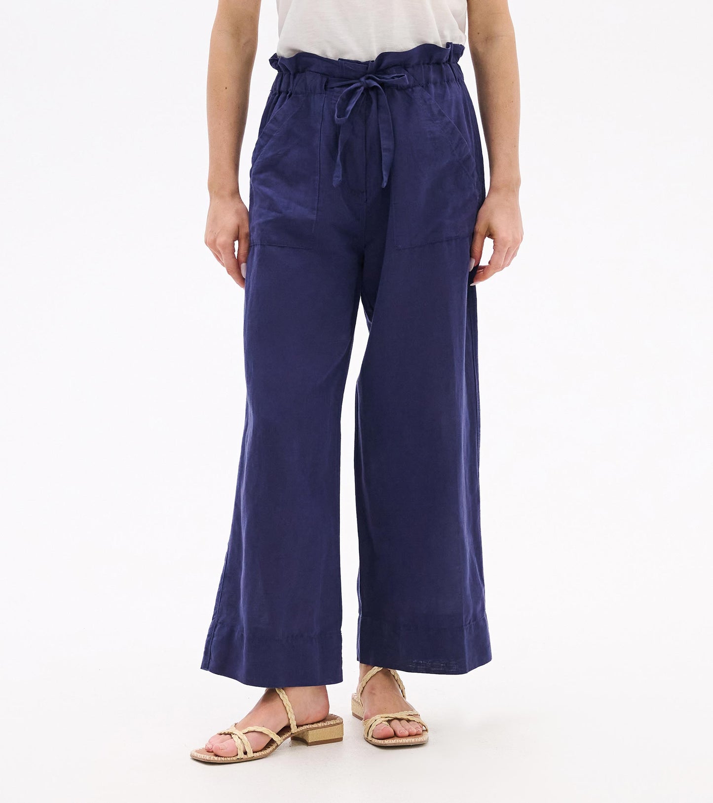 Patriot blue wide-leg pants with a tie waist and cropped hem, front view.