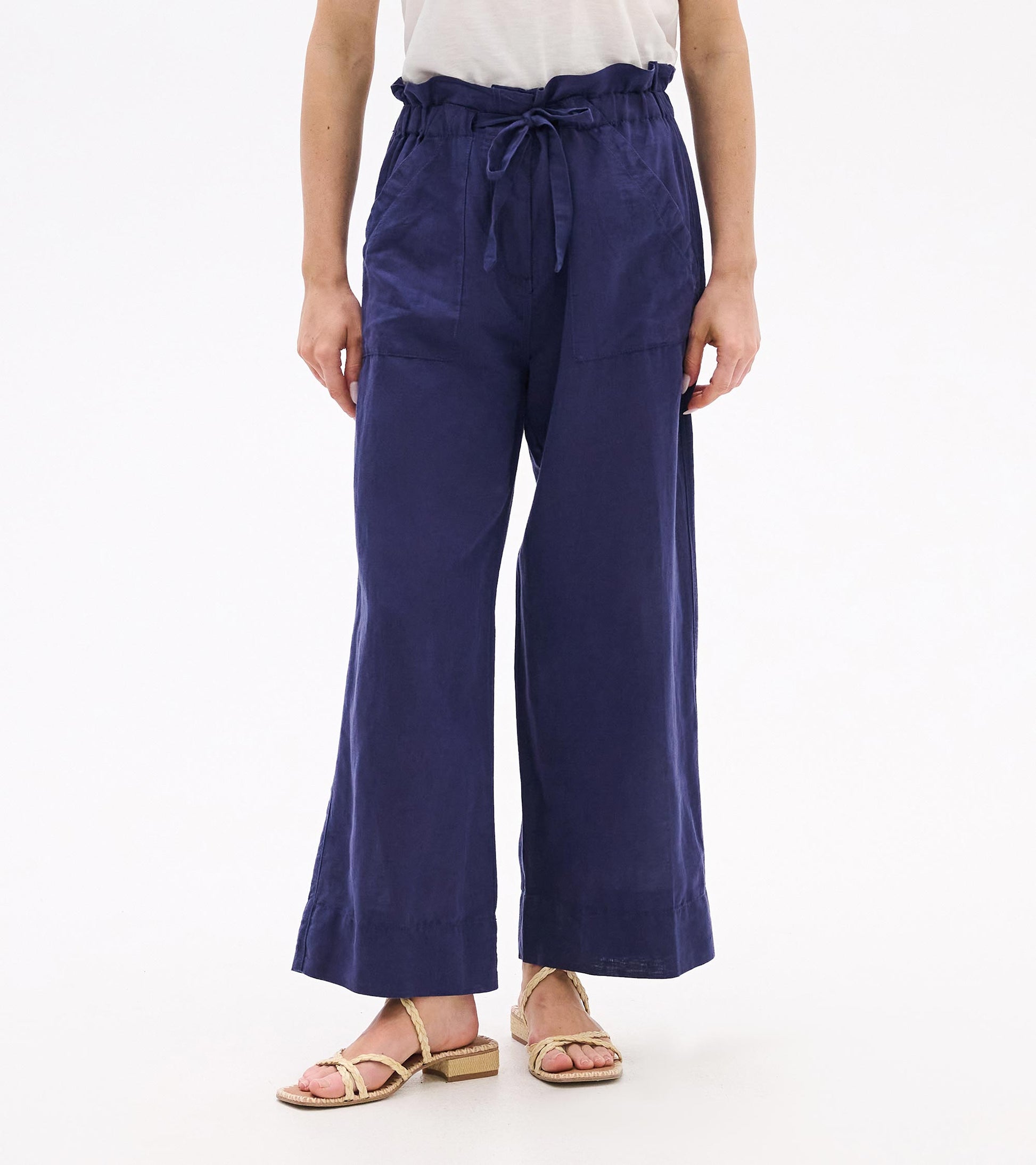 Patriot blue wide-leg pants with a tie waist and cropped hem, front view.
