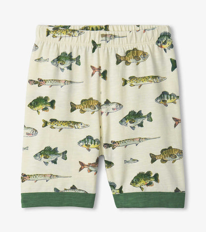 Cream boys pajama shorts with fish print and green cuffs, front view
