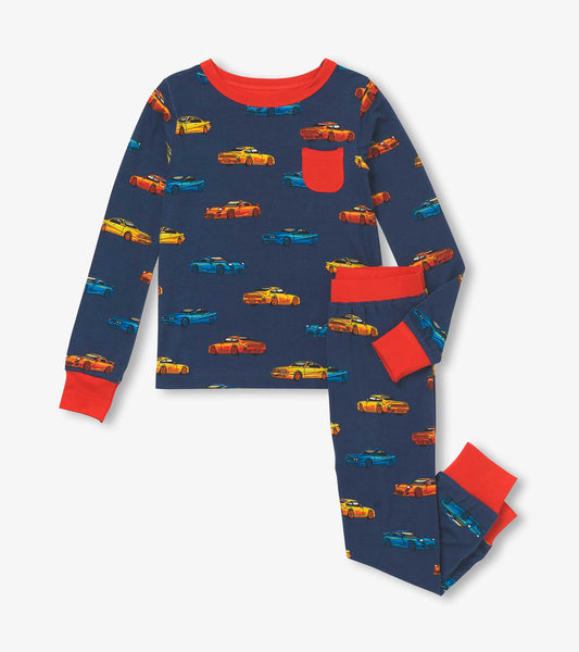 Navy boys pajama set with colorful sports car print and red trim, shown front view with long sleeves and pants