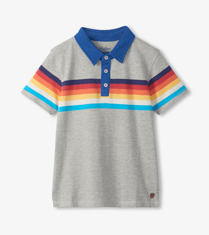 Grey boys polo T-shirt with blue collar and rainbow stripes across the chest and sleeves