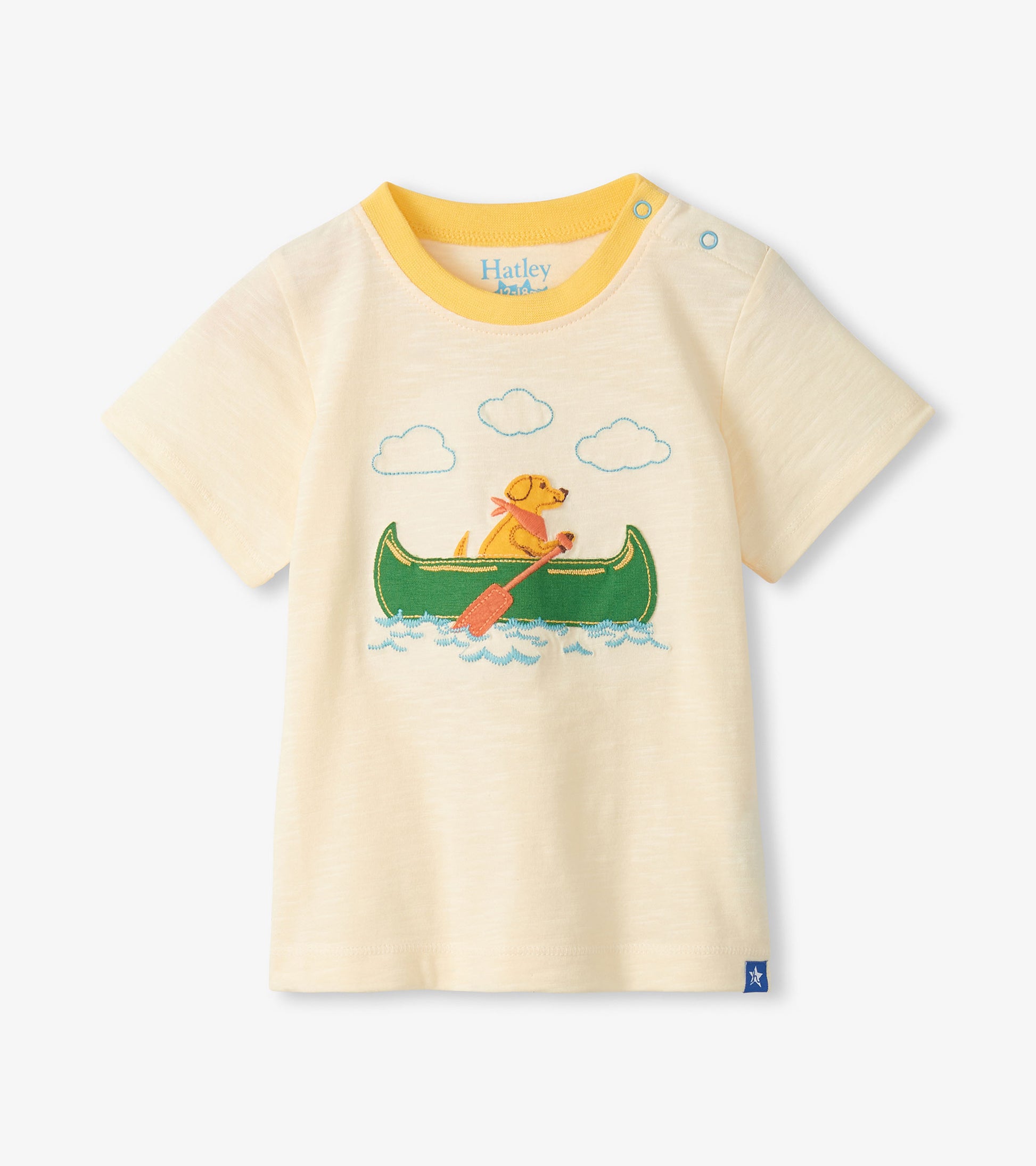 Cream short-sleeve toddler T-shirt with yellow trim and a dog canoe graphic on the front