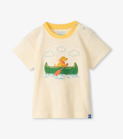 Cream short-sleeve toddler T-shirt with yellow trim and a dog canoe graphic on the front