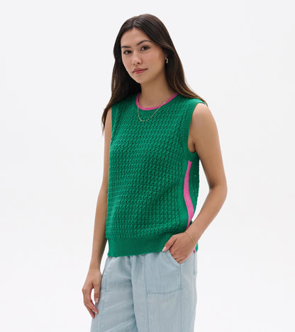 Green knit sleeveless tank top with pink trim and side stripe, worn with light blue pants, front view