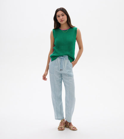 Green sleeveless knit tank top with ribbed trim and pink neckline, shown on a model front view