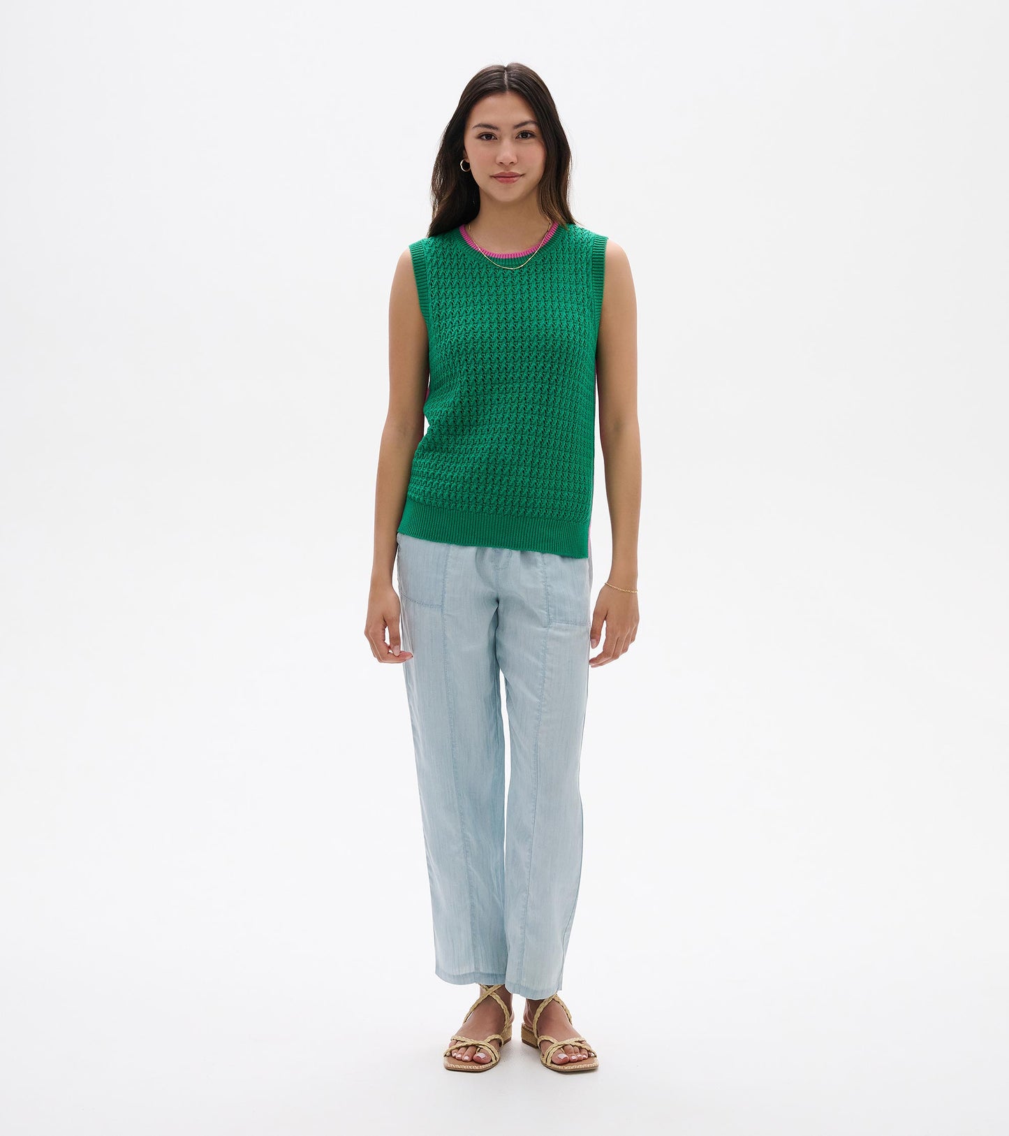 Green sleeveless knit tank top with ribbed trim and textured pattern, shown on a model front view.