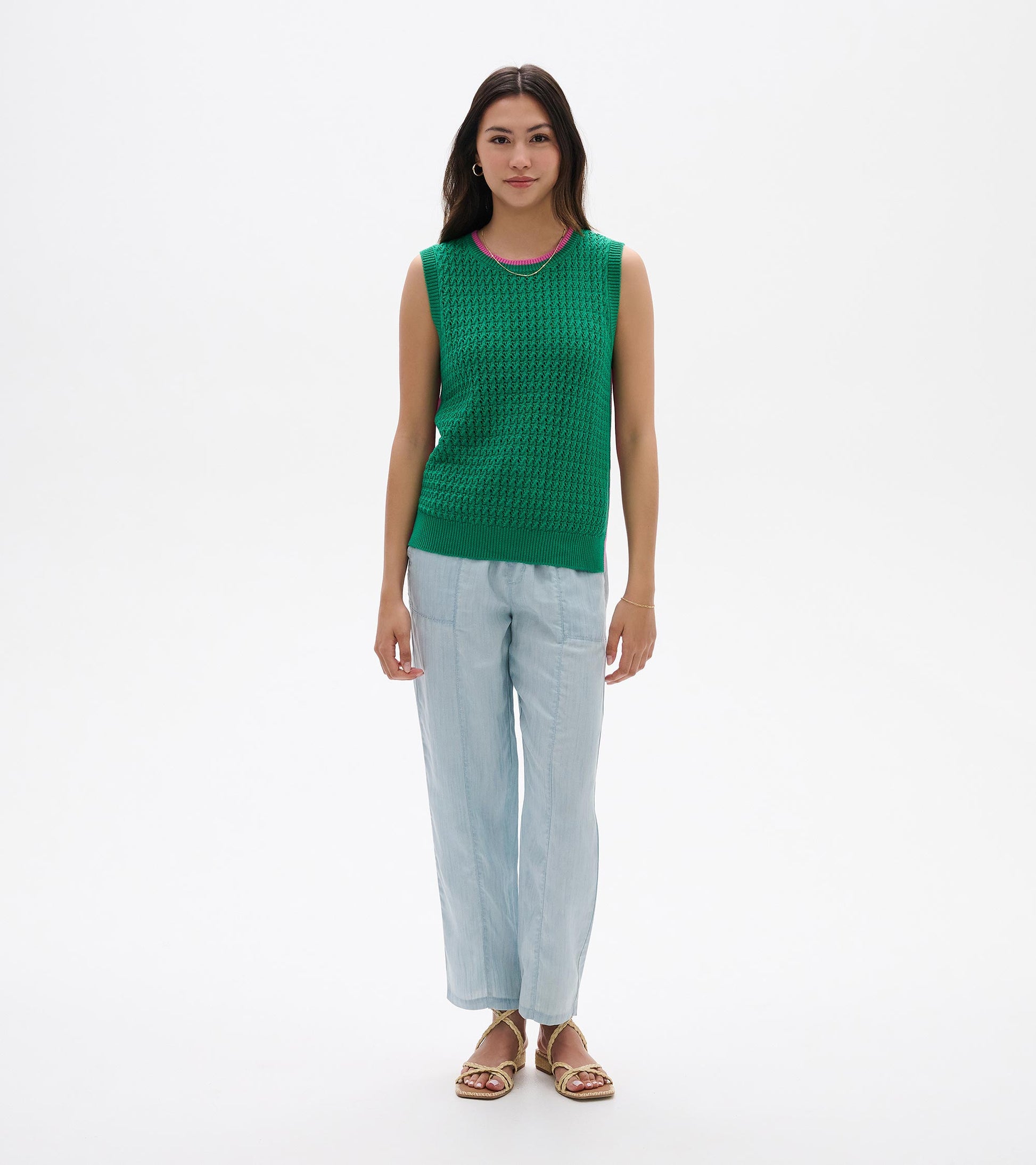 Green sleeveless knit tank top with ribbed trim and textured pattern, shown on a model front view.