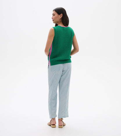 Green knit sleeveless tank top with pink trim, shown from the back on a model