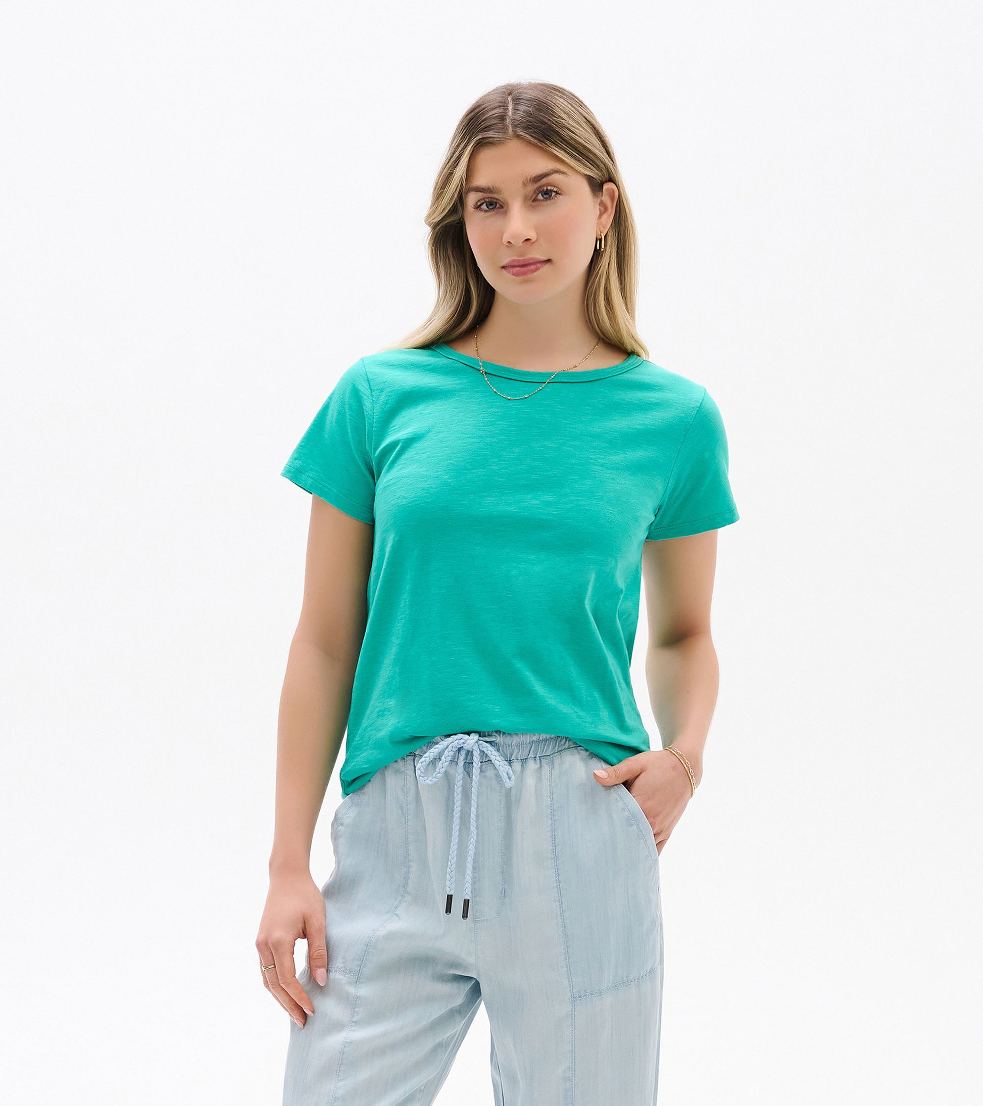 Turquoise short-sleeve crew neck tee on a model, front view