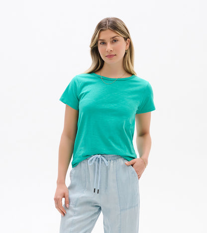 Turquoise short-sleeve crew neck tee on a model, front view