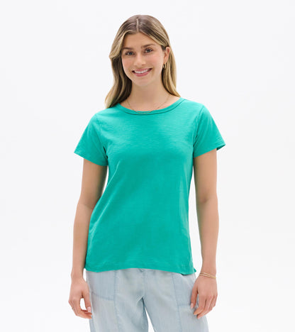 Turquoise short-sleeve crew neck tee on a model, front view, with a relaxed fit.