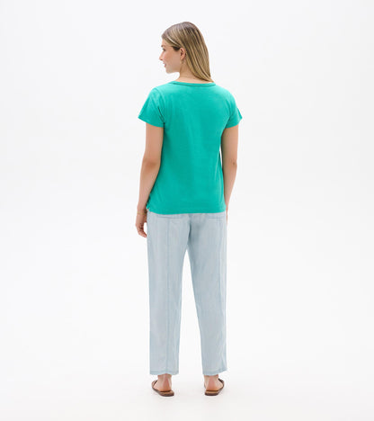Teal short-sleeve crew neck T-shirt shown from the back on a model