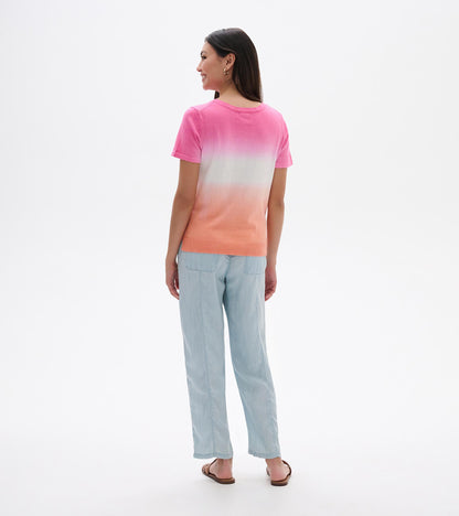 Back view of a pink-to-coral dip-dye knit tee with short sleeves and ribbed hem