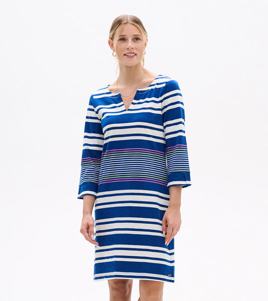 Woman wearing blue-and-white striped V-neck dress with three-quarter sleeves and multicolor stripe accents, front view