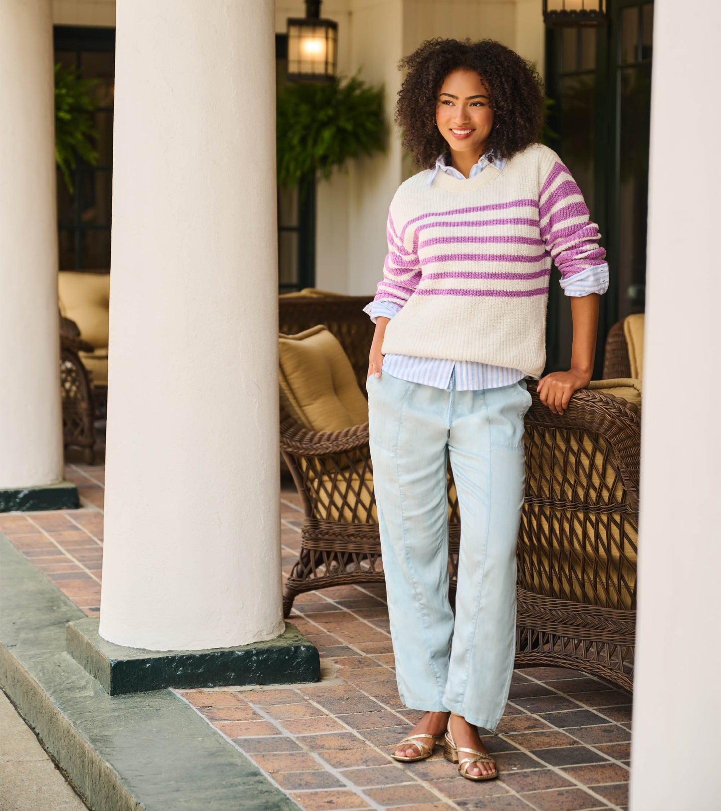 Light blue straight-leg pants worn with a relaxed fit and drawstring waist, front view on model