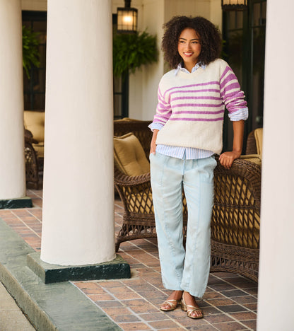 Light blue straight-leg pants worn with a relaxed fit and drawstring waist, front view on model
