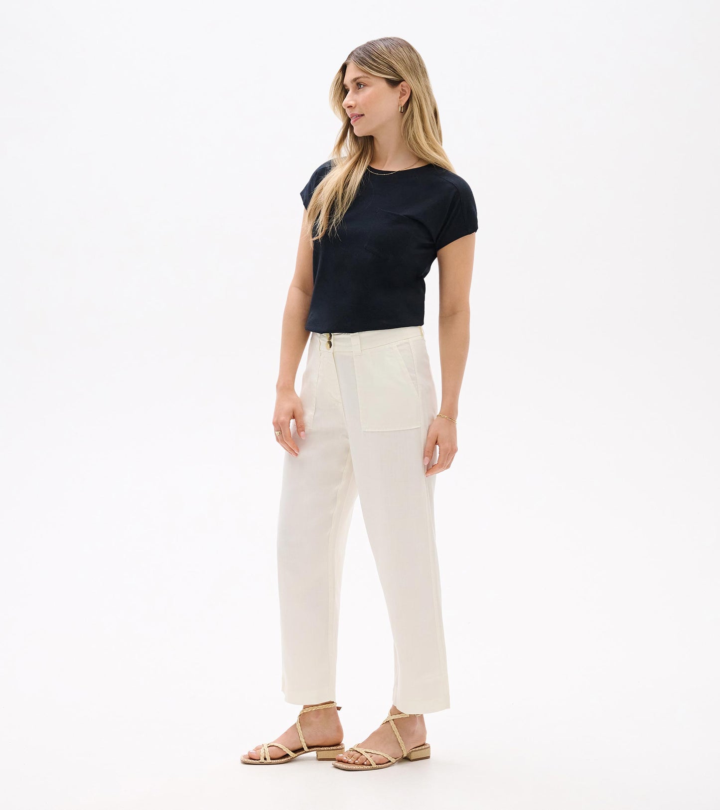 Black relaxed short-sleeve tee with a crew neckline, shown on a model in a front view.