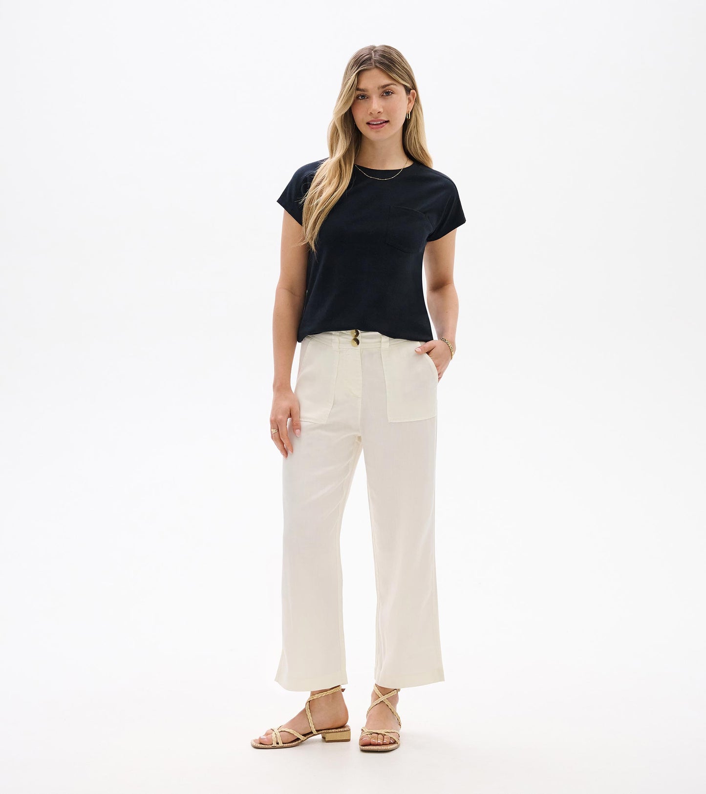 Black relaxed-fit short-sleeve tee with crew neckline and chest pocket, shown on model front view