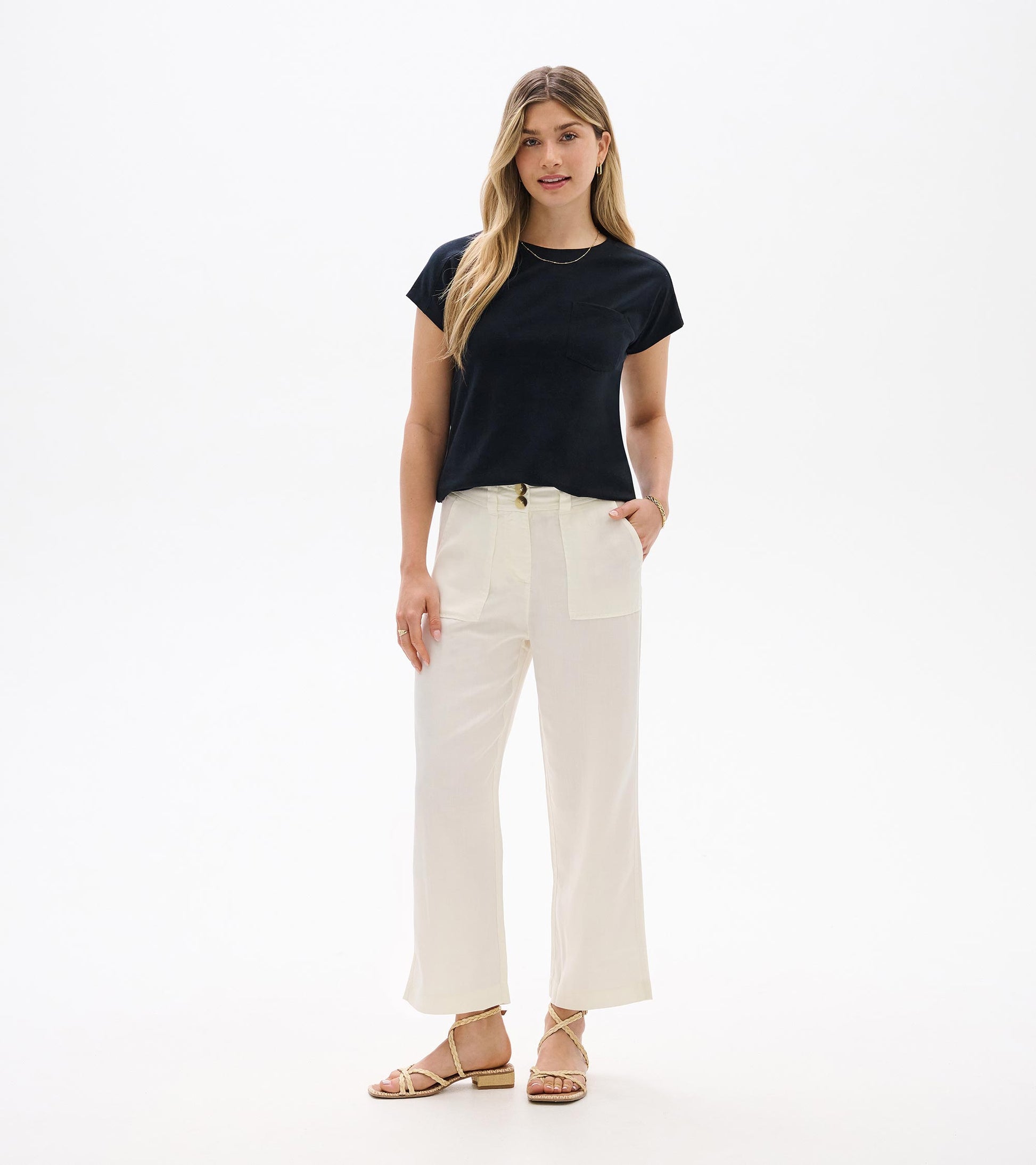 Black relaxed-fit short-sleeve tee with crew neckline and chest pocket, shown on model front view