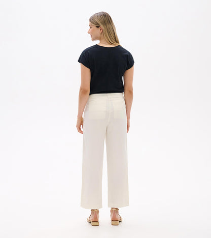 Black relaxed short-sleeve tee shown from the back on a model, with a loose fit and crew neckline.