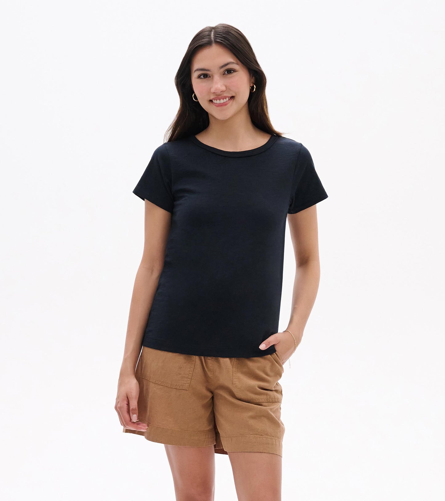 Black crew neck short-sleeve tee worn with tan shorts, front view