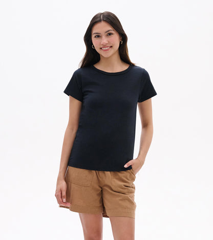Black crew neck short-sleeve tee worn with tan shorts, front view