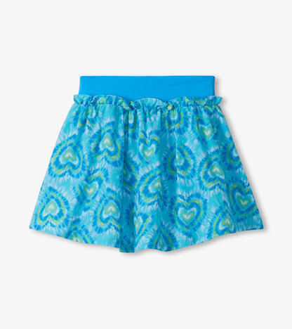 Girls blue ruffle skort with heart tie-dye print and wide waistband, front product view