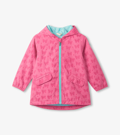 Pink hooded girls' rain jacket with butterfly print, front zipper, flap pockets, and blue lining.